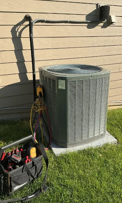 Outdoor Air conditioning unit with tools next to it