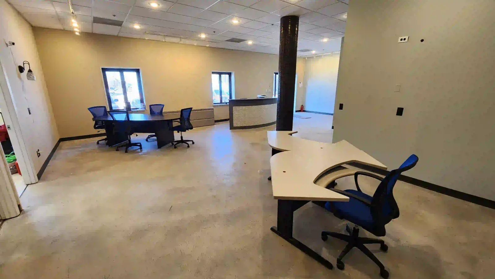 Empty room with chairs and tables lying around