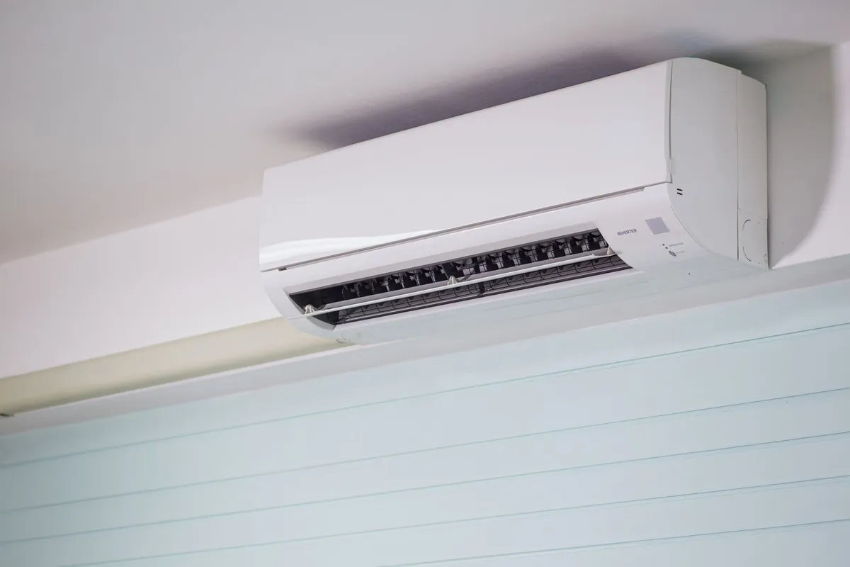 Wall-mounted ductless mini-split air handler in a room