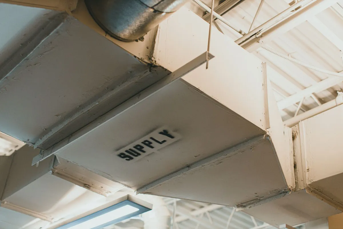 Ceiling ductwork with a branch labelled SUPPLY