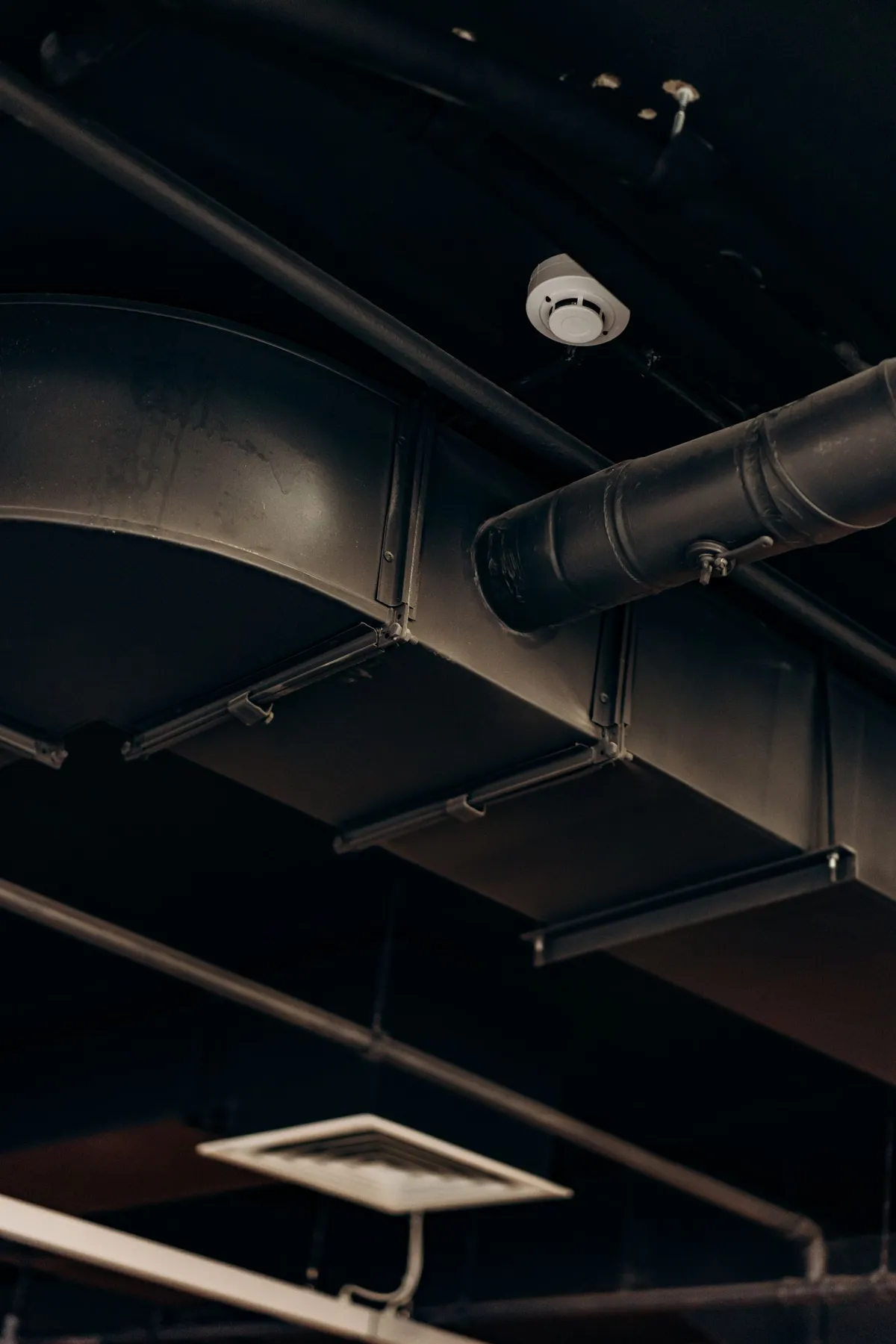 Rectangular ductwork running across a ceiling